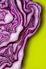Obraz premium Red Cabbage cut, with inner patterns of folded leaves visible