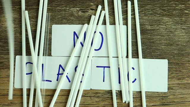 Moving  plastic  straw  by wind   and  reveal    no plastic word on board