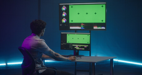 Video editor at work in editing room