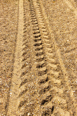 Tractor on beach waiting for fishing boats to return 