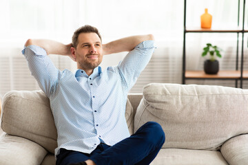 Man having rest at home on the sofa