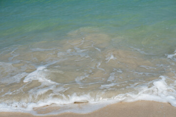 Backgrounds of quiet clear clean water sea white sand beach in summer holiday in Thailand