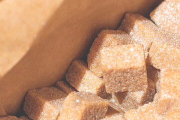 Brown sugar  in cubes, packed in paper