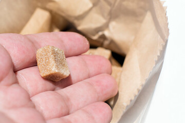 Brown sugar  in cubes, packed in paper