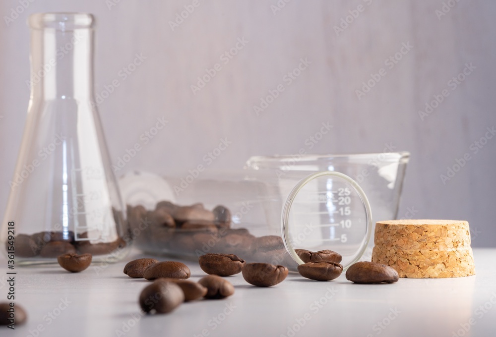 Sticker Close up shot of coffee beans in laboratory glassware being tested