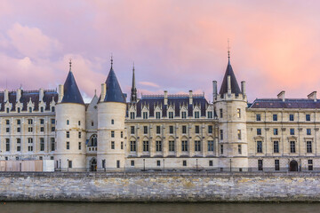 Fototapeta na wymiar Castle Conciergerie - former royal palace and prison. Conciergerie located on the west of the Cite Island and today it is part of larger complex known as Palais de Justice. Paris, France. Sunset.