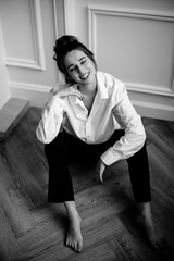 young woman sitting on the floor