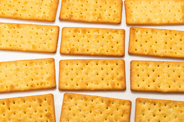 Cracker with salt isolated on white.