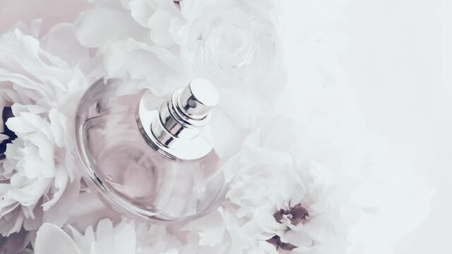 White perfume bottle with peony flowers, chic fragrance scent as luxury cosmetic, fashion and beauty product backgrounds