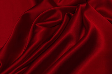 Red silk or satin luxury fabric texture can use as abstract background.