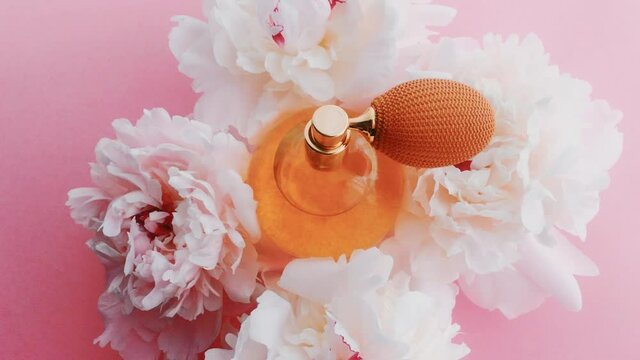 Citrus perfume bottle with peony flowers, chic fragrance scent as luxury cosmetic, fashion and beauty product backgrounds