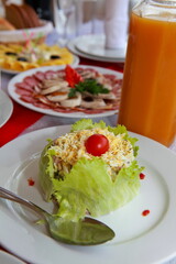 plate with salad, sausage slicing in a restaurant