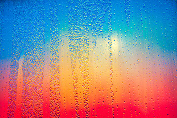 Obraz na płótnie Canvas Drops on the Glass . Gradient from Red to Blue 