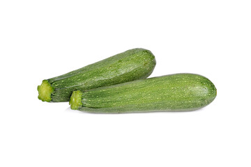 whole unpeeled fresh zucchini on white background