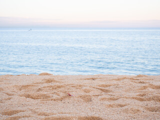 Fototapeta na wymiar beach.warm yellow sand and summer sea with sky and free space sunset