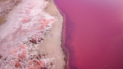 Scenic colorful Pink Salt Lake in Ukraine. unusual color cause of an algae with red pigments.  Amazing seascape.