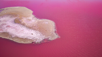 Scenic colorful Pink Salt Lake in Ukraine. unusual color cause of an algae with red pigments.  Amazing seascape.