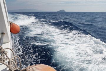 View of sailing boat with water splash