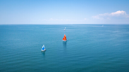 Fototapeta premium Aerial view of sailing yachts regatta competition.