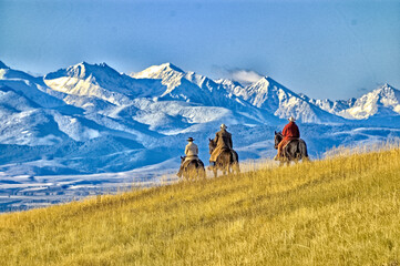 Cowboys on the range mountain background