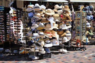 Greece, Athens, June 17 2020 - Hats stacked on stands outside store at Monastiraki square.