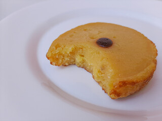 Kue Lumpur or Mud Cake. Traditional cake in Indonesia. Made from potato, flour, coconut milk and egg. Isolated in white background.