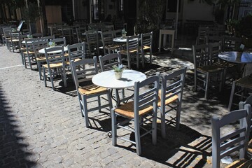 Greece, Athens, June 17 2020 - Empty chairs of a traditional bar-restaurant in the touristic district of Monastiraki.