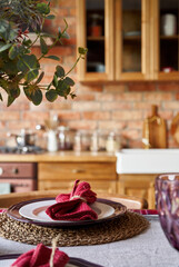 Serving for dinner on kitchen table. Warm kitchen background interior.