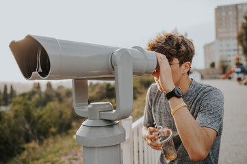 man watch in telescope 
