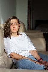 Obraz premium Young woman at home. The concept of natural beauty, femininity, feminism, body positive.
