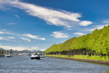 View on the Amsterdam Rijn Kanaal in the Netherlands, an important waterway for shipping freight on large boats and ships. Also an environment with possibilities for recreation.