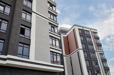 Modern European residential apartment buildings quarter on a sunny day with a blue sky.Abstract architecture, fragment of modern urban geometry