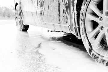 car in foam at the car wash