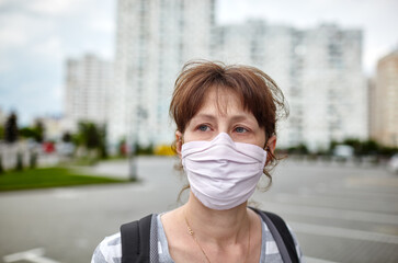 Woman wearing hygienic mask to prevent the Coronavirus. People in masks The outbreak of Novel...