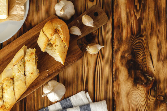 Sliced fresh baguette with garlic oil and herbs