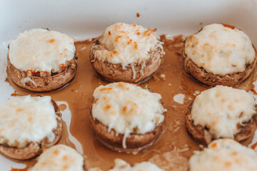 Baked mushroom caps stuffed in a baking dish