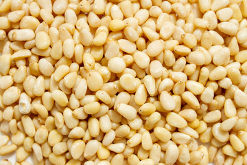 Shelled Pine nuts Background texture.