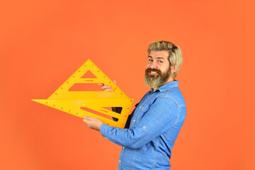 Drawing lesson. Measurement tool. Studying math. Education concept. School education. Teaching geometry. Auxiliary equipment. Architect education. Bearded man teacher use ruler. Innovative approach