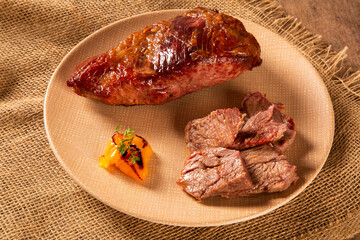 Hot Grilled Whole Tri-tip Steak or rump skirt on a plate
