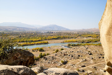 Autumn landscapes with fantastic views from mountain to valley and blue river. Colourful mountain nature in autumn, summer, or spring day