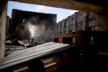 Fototapeta na wymiar Burned house interior after fire, ruined building room inside, disaster or war aftermath