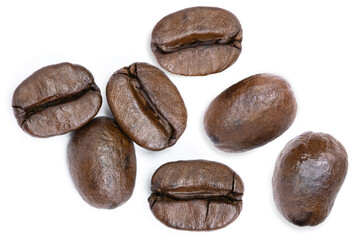 Closeup dark brown coffee beans isolated on white background. Top view. Flat lay.