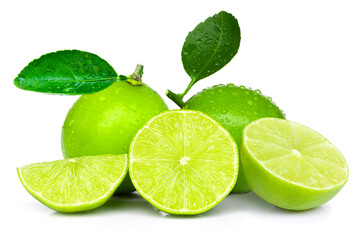 Fototapeta na wymiar Fresh organic green Lime fruits with cut in half slice and green leaves isolated on white background. 
