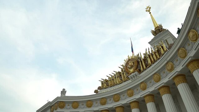 Soviet building with columns and stucco molding.Close-up view dolly camera shot