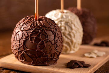 Candied apples on sticks with chocolate