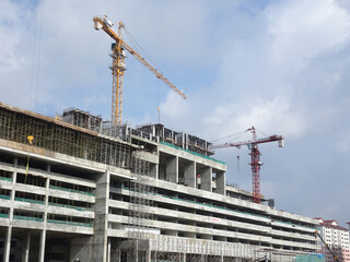 KUALA LUMPUR, MALAYSIA -MAY 15, 2020: Tower Crane used to lift the heavy load at the construction...