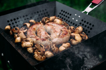 Grilled chicken sausage with mushrooms in a pan
