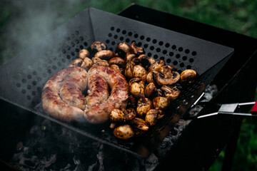 Grilled chicken sausage with mushrooms in a pan