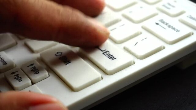 His hand working with computer and mouse keyboard