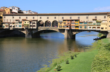 Fototapeta na wymiar Old Bridge called Ponte Vecchio over Arno River in Tuscany Regio